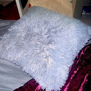 A little gray pillow tender and sweet for kids or dogs